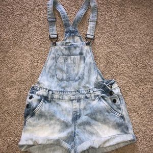 Acid washed overalls.